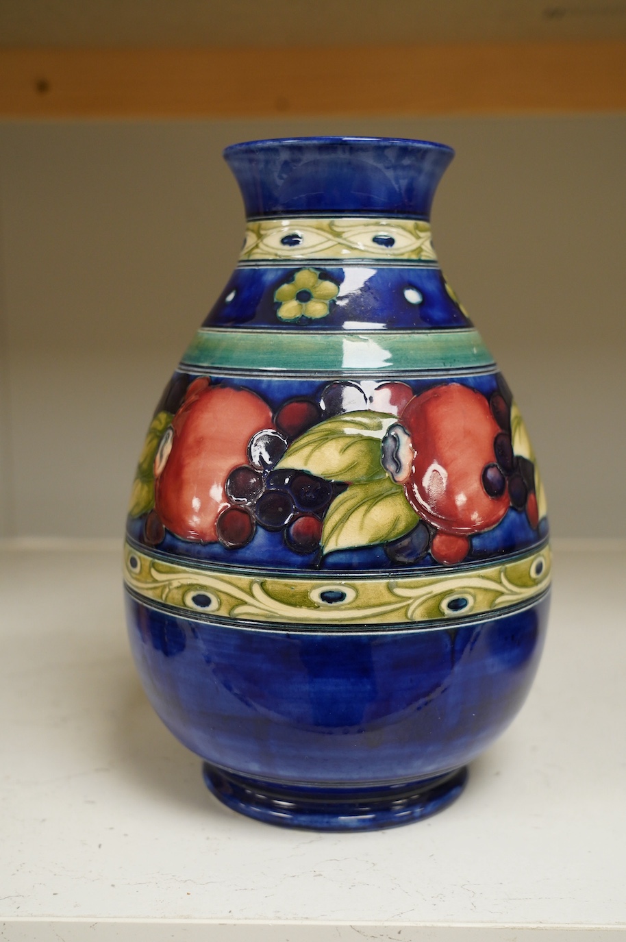 A Moorcroft banded pomegranate ovoid vase, 1930s, signed, 24cm high. Condition - good